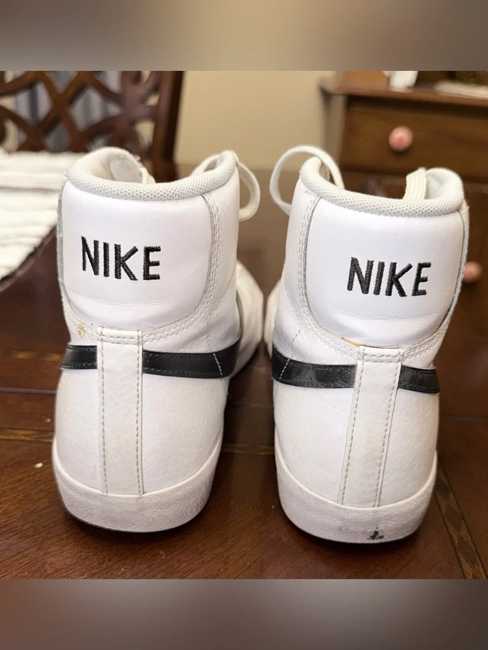 Nike White High-Top Sneakers with Black Swoosh